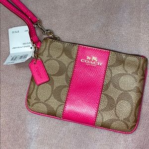 Pink and brown Coach Wristlet